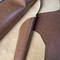 La tela acabada partida bovina del cuero artificial para los zapatos empaqueta la ropa de las correas